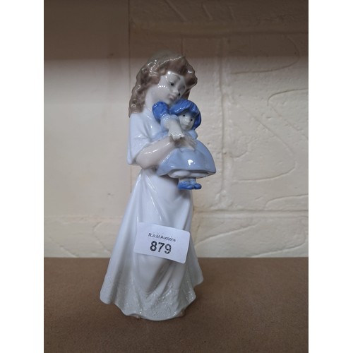 879 - 8” Nao Girl Holding A Rag Doll