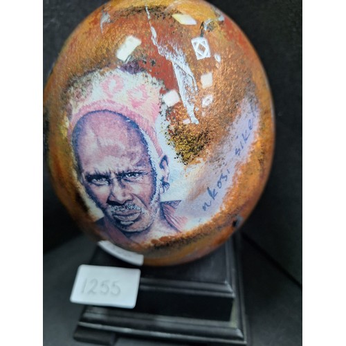 1255 - Hand Painted and Signed Ostrich Egg On a Stand  NKOSI SIKELLE