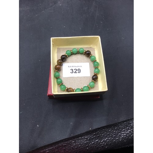 329 - Presented as jade + tigers eye bracelet with gold tone beads