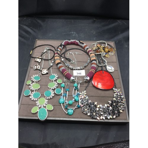 346 - F+v pad of necklaces inc. Claire’s accessories etc.