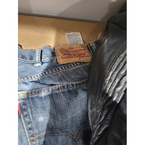 304 - Levi Jeans Size 34W and 32L and a Euro Style Bikers Jacket Size 46