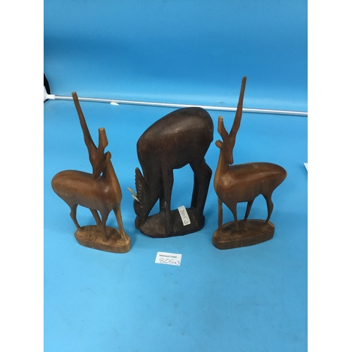 805 - 3 carved wooden stags