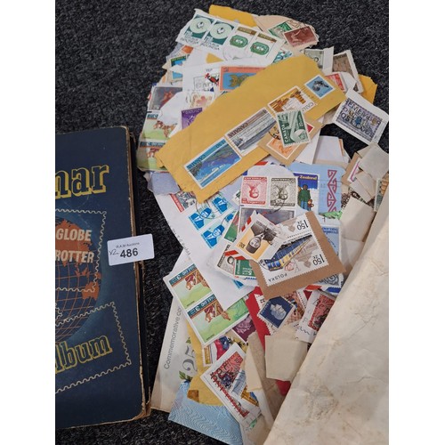 486 - Stamp Album and a Pack of Hundreds of Vintage Unchecked Stamps