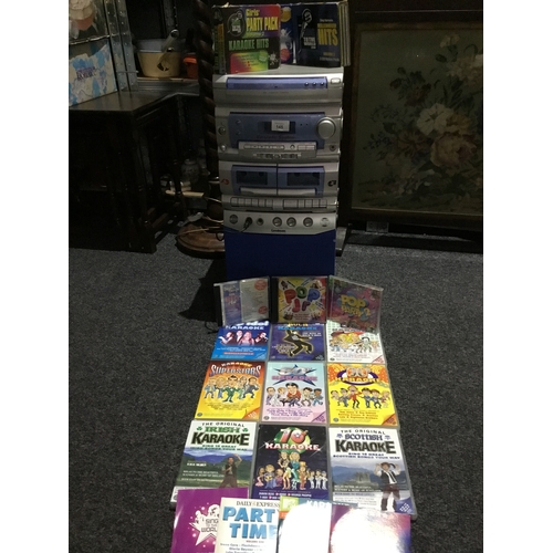 145 - Goodman’s Karaoke Machine With 16 DVDs Plus 3x Box Sets of Music