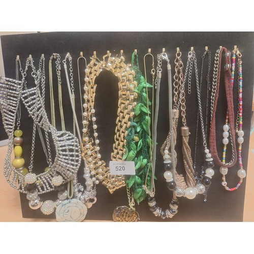 520 - Stand of fashion and vintage necklaces inc. natural shell,stones etc.