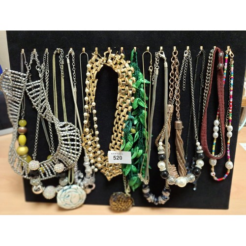 520 - Stand of fashion and vintage necklaces inc. natural shell,stones etc.