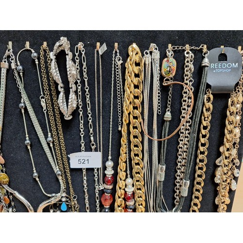 521 - Stand of Fashion and Vintage Necklaces, Bangles Etc To Include Stoned Etc.