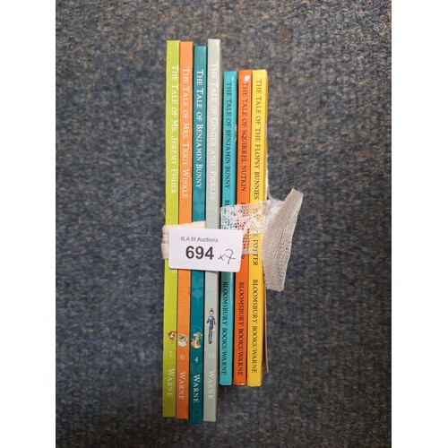 694 - Carrot Wrapped Beatrix Potter Books x6 and One Extra Book