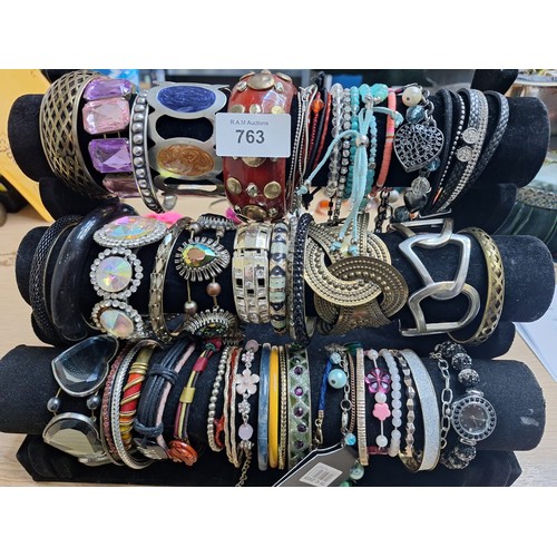 763 - Stand of 3 Rolls Of Fashion and Vintage Bangles