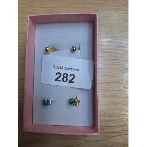 282 - Boxed Untested Yellow Metal Earrings x2 One Is Stoned