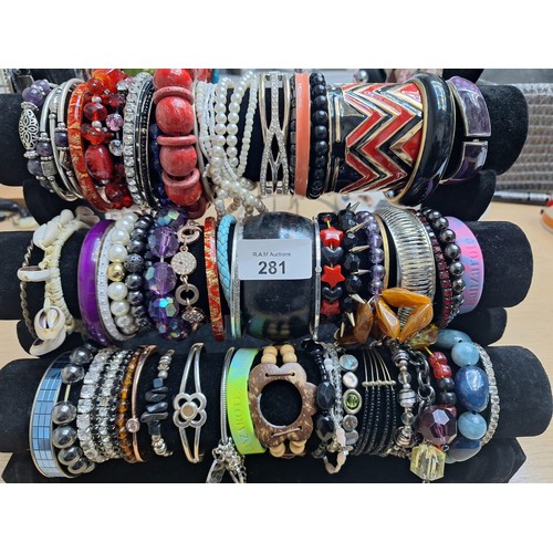 281 - Three Rolls of Fashion and Vintage Bangles and Bracelets (stand not included)