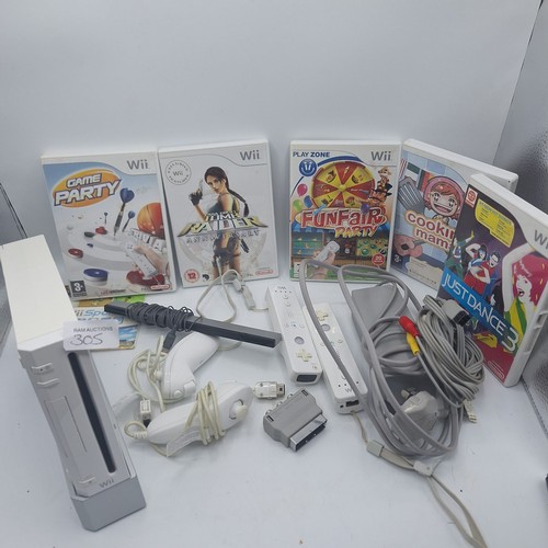 305 - WII CONSOLE AND 4 CONTROLLERS, LEADS. STAND ETC AND5 GAMES