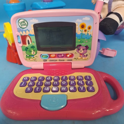74 - Kiddies Toys x3 To Include Leap Frog Play and Learn, Push and Pull Train and a Baby Doll On a Scoote... 