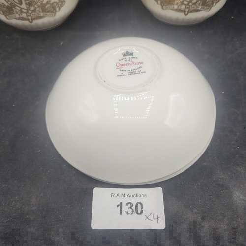 130 - A Group of Four Queen Anne Bone China Royal Commemorative Mugs and Saucers