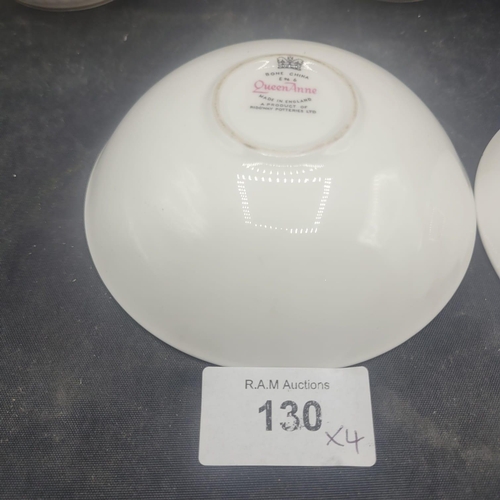 130 - A Group of Four Queen Anne Bone China Royal Commemorative Mugs and Saucers