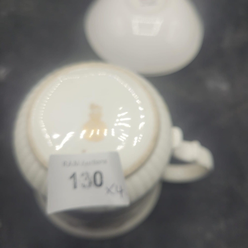 130 - A Group of Four Queen Anne Bone China Royal Commemorative Mugs and Saucers