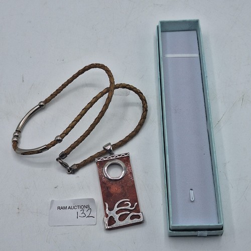 132 - BOXED SUPER DESIGNER PENDANT ON STONE WITH SILVER DESIGN UNMARKED