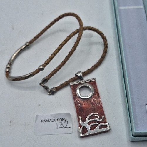 132 - BOXED SUPER DESIGNER PENDANT ON STONE WITH SILVER DESIGN UNMARKED