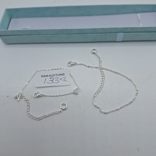 133 - BOXED STONED SILVER TONE BRACELETS X2