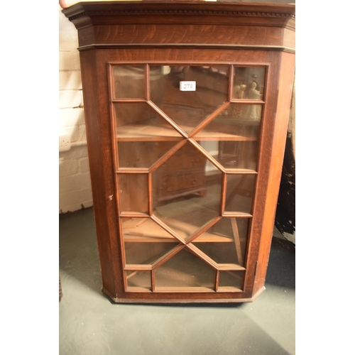 278 - 19th century oak corner cupboard with astragal glazed door