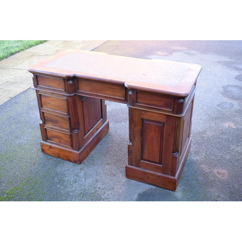 288 - 20th century knee hole desk with draws and a cupboard with a leather inset