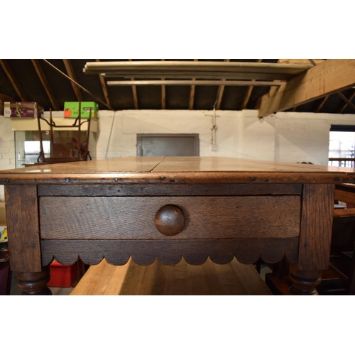 349 - Late Victorian oak kitchen table with boarded top with lobed apron piece turned legs with folding si... 