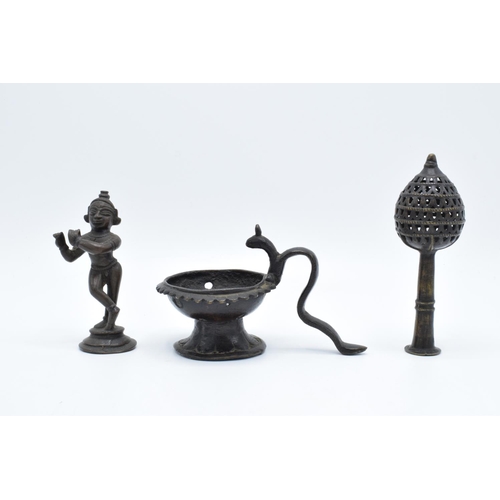 104 - A collection of antique Oriental/ Asian bronze items to include a lamp, a figure of a goddess and an... 