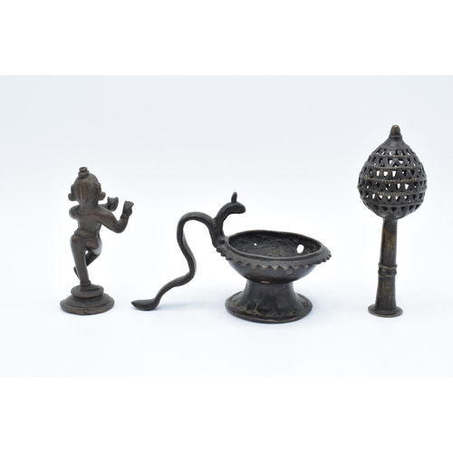 104 - A collection of antique Oriental/ Asian bronze items to include a lamp, a figure of a goddess and an... 