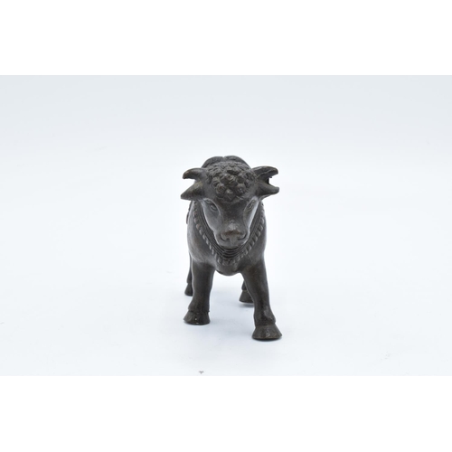 105 - Antique Oriental heavy bronze figure of a bull. In good condition with no obvious damage or restorat... 