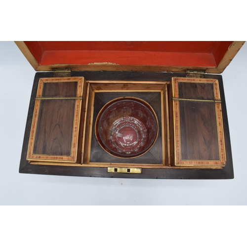 106 - Rosewood tea caddy with boxwood stringing inlay complete with original caddies and an associated mix... 