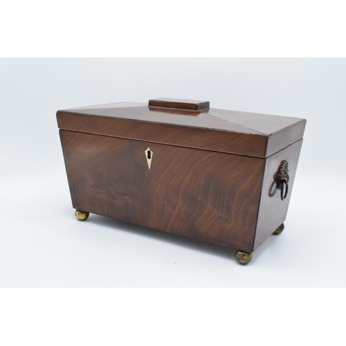 108 - 19th century mahogany tea caddy in a sarcophagus form mounted on brass ball feet. In good condition ... 