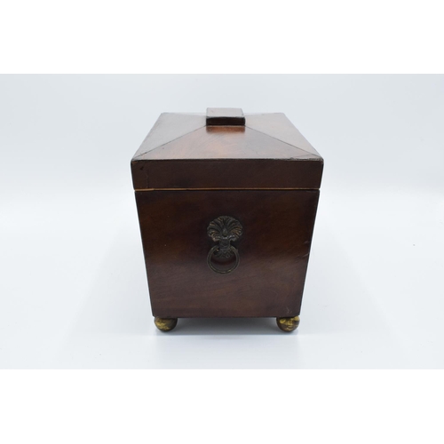 108 - 19th century mahogany tea caddy in a sarcophagus form mounted on brass ball feet. In good condition ... 