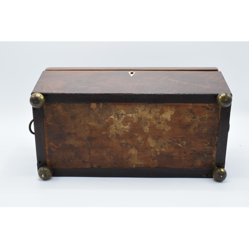 108 - 19th century mahogany tea caddy in a sarcophagus form mounted on brass ball feet. In good condition ... 