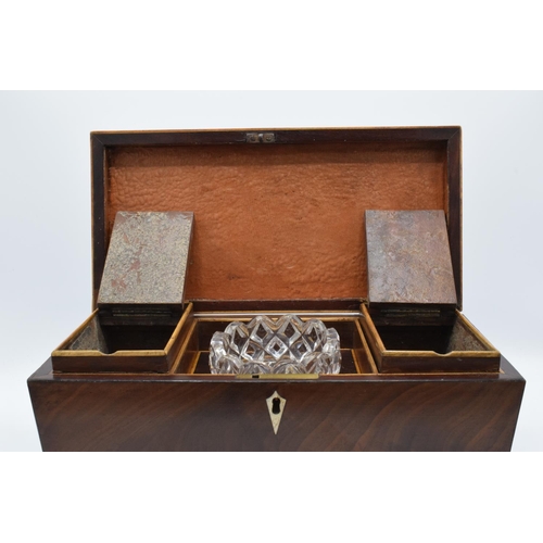 108 - 19th century mahogany tea caddy in a sarcophagus form mounted on brass ball feet. In good condition ... 