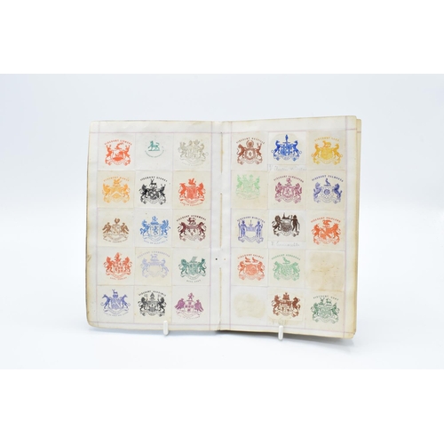 198 - Antique crest book to include crests from: MPs, Royalty and famous figures, hotels, schools, militar... 