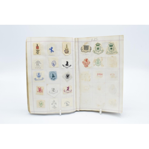 198 - Antique crest book to include crests from: MPs, Royalty and famous figures, hotels, schools, militar... 