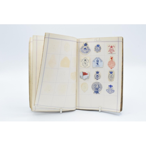 198 - Antique crest book to include crests from: MPs, Royalty and famous figures, hotels, schools, militar... 