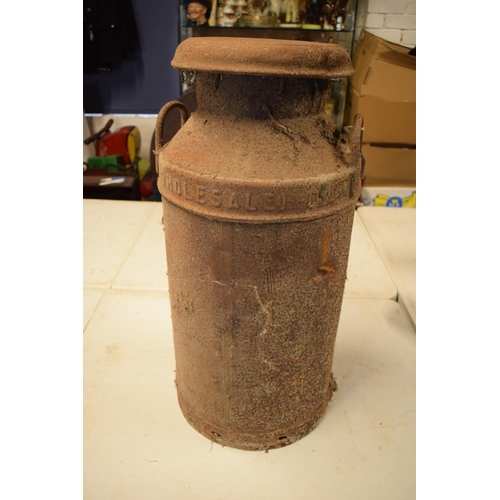 200 - 20th century milk churn 'United Dairies Wholesale LTD'. Badly rusted. Small dent in the side. 72cm t... 