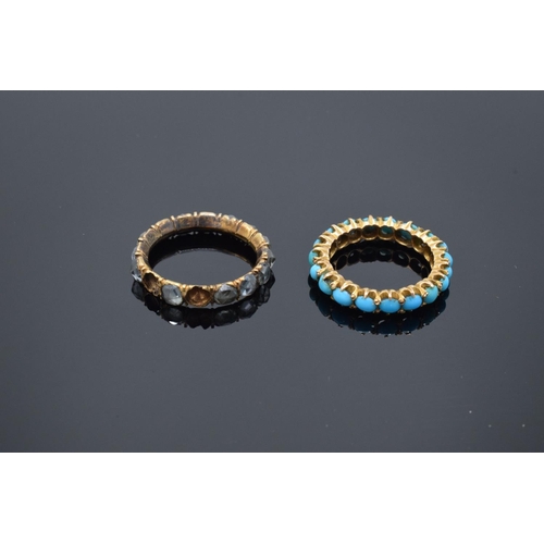 215 - Two full eternity style gem set rings set in yellow coloured metal: Both rings UK size K, gross weig... 