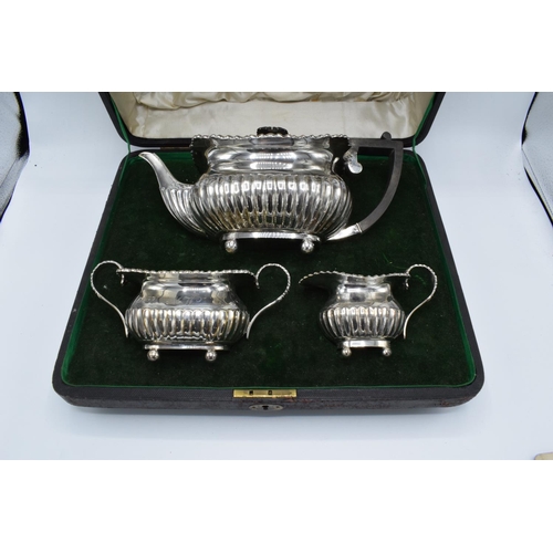 222 - Silver 3 piece tea set to include the teapot, milk and sugar: hallmarked for London 1905 (1120 grams... 