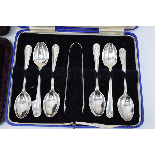 226 - 6 cased silver tea spoons (London 1895) together with a cased set of 6 tea spoons and a pair of suga... 