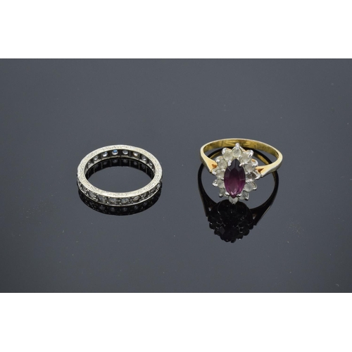 234 - A 9ct dress ring (stamped 375) together with a 9ct eternity ring (stamped 9ct): both with semi-preci... 