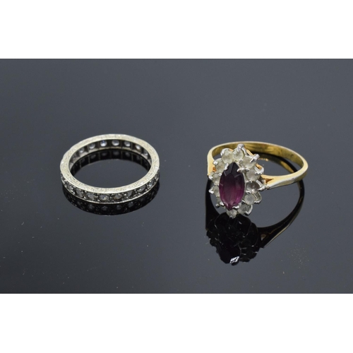 234 - A 9ct dress ring (stamped 375) together with a 9ct eternity ring (stamped 9ct): both with semi-preci... 