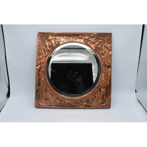 272 - Arts and Crafts copper framed mirror. Tthe copper is battered and bruised consistently on the piece.... 