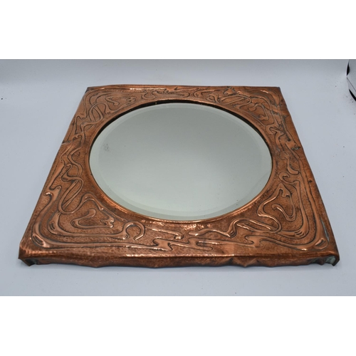 272 - Arts and Crafts copper framed mirror. Tthe copper is battered and bruised consistently on the piece.... 