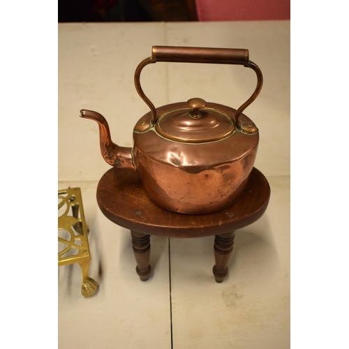 279 - A mixed collection of items to include: copper tea pot, brass lion trivet and a wooden Childs stool ... 