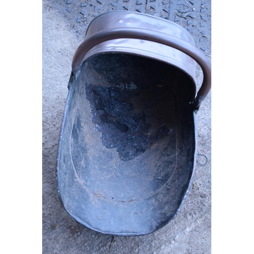 280 - 2 Victorian copper helmet coal scuttles. The floor has started to disintegrate in one example. The b... 