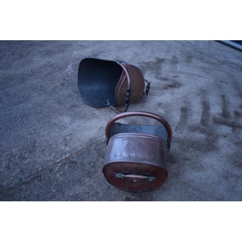 280 - 2 Victorian copper helmet coal scuttles. The floor has started to disintegrate in one example. The b... 