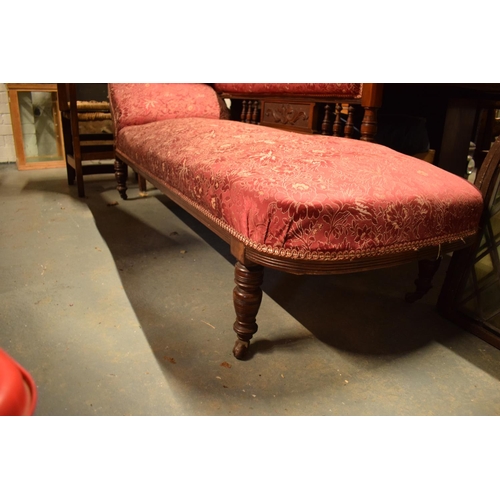 289 - Edwardian upholstered mahogany chaise-longue. The springs have gone spongey. Damage to the carving b... 