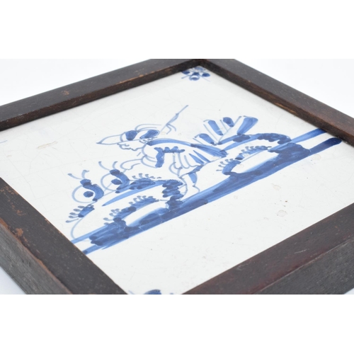 48 - 19th century framed blue and white Delft tile. There is some crazing and also some surface damage. 1... 